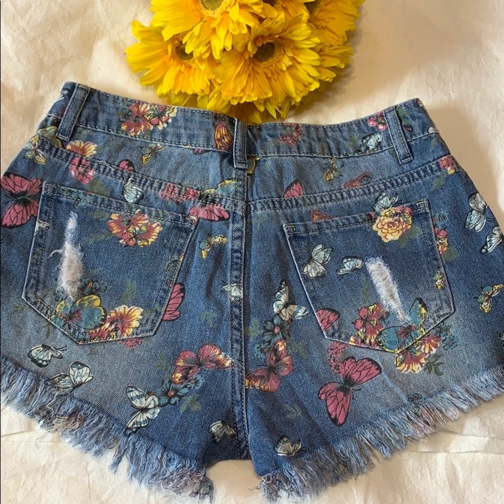 BLUE RIPPED BUTTERFLY DENIM SHORTS WITH RAW HEM - Picture 7 of 10